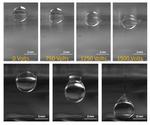 Dielectrophoretic control of a droplet at the interface of two liquids in a three-liquid system
